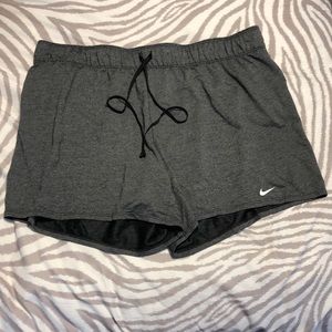 Gray and black Nike basketball shorts, size XL